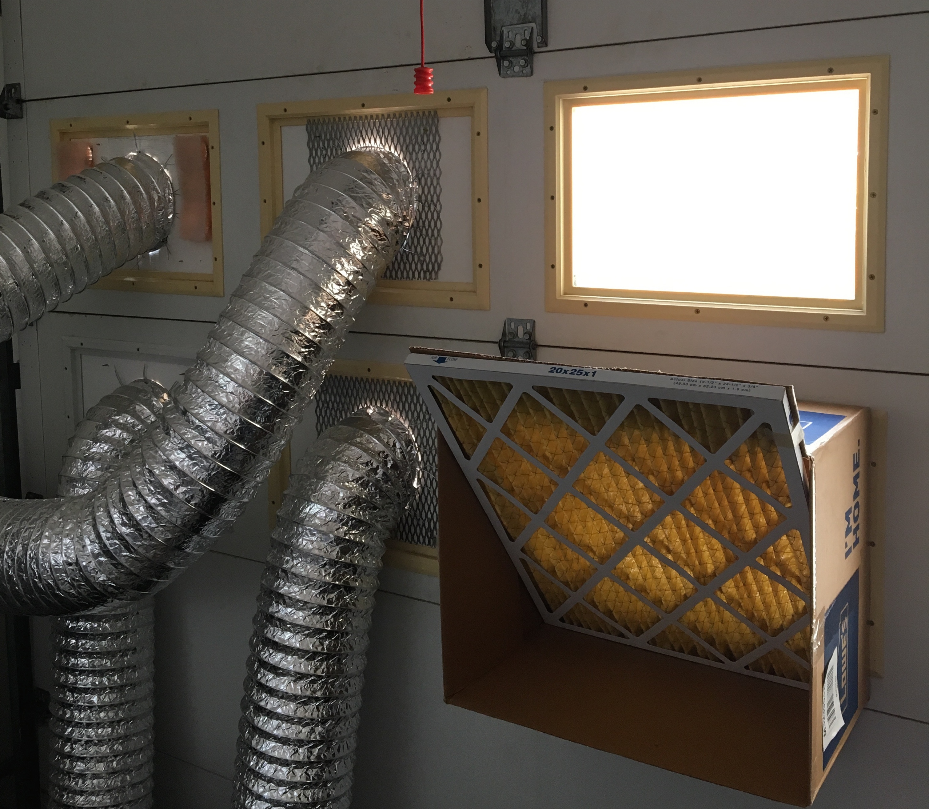 Inside attachment of ducts to garage door.